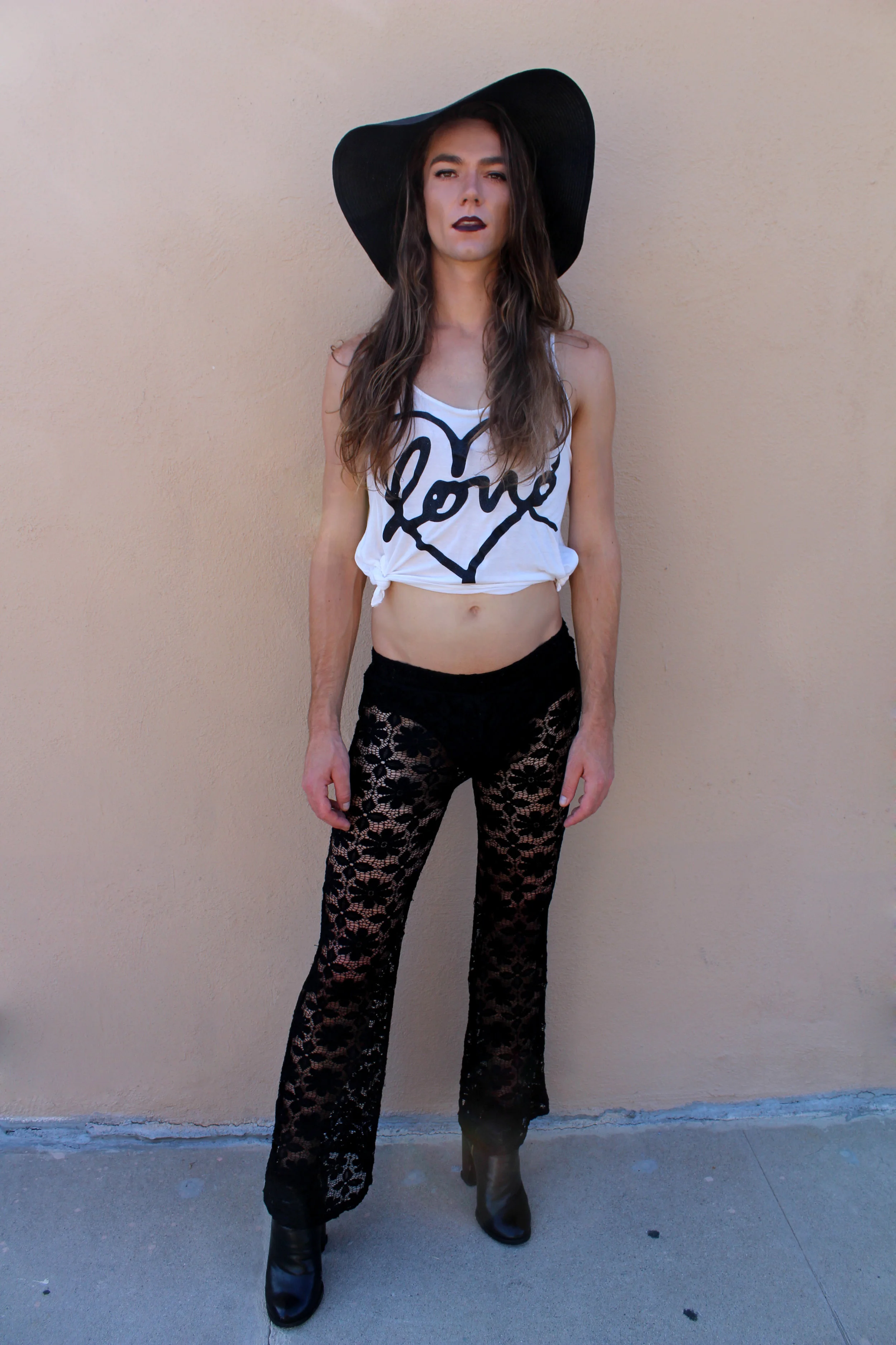 Photo by: Chloe Diaz Kyle Wears Cute Love Tank Tied at the Sides with Lace Pants and Oversized Hat and Black Booties. Great for that Summer Stroll.