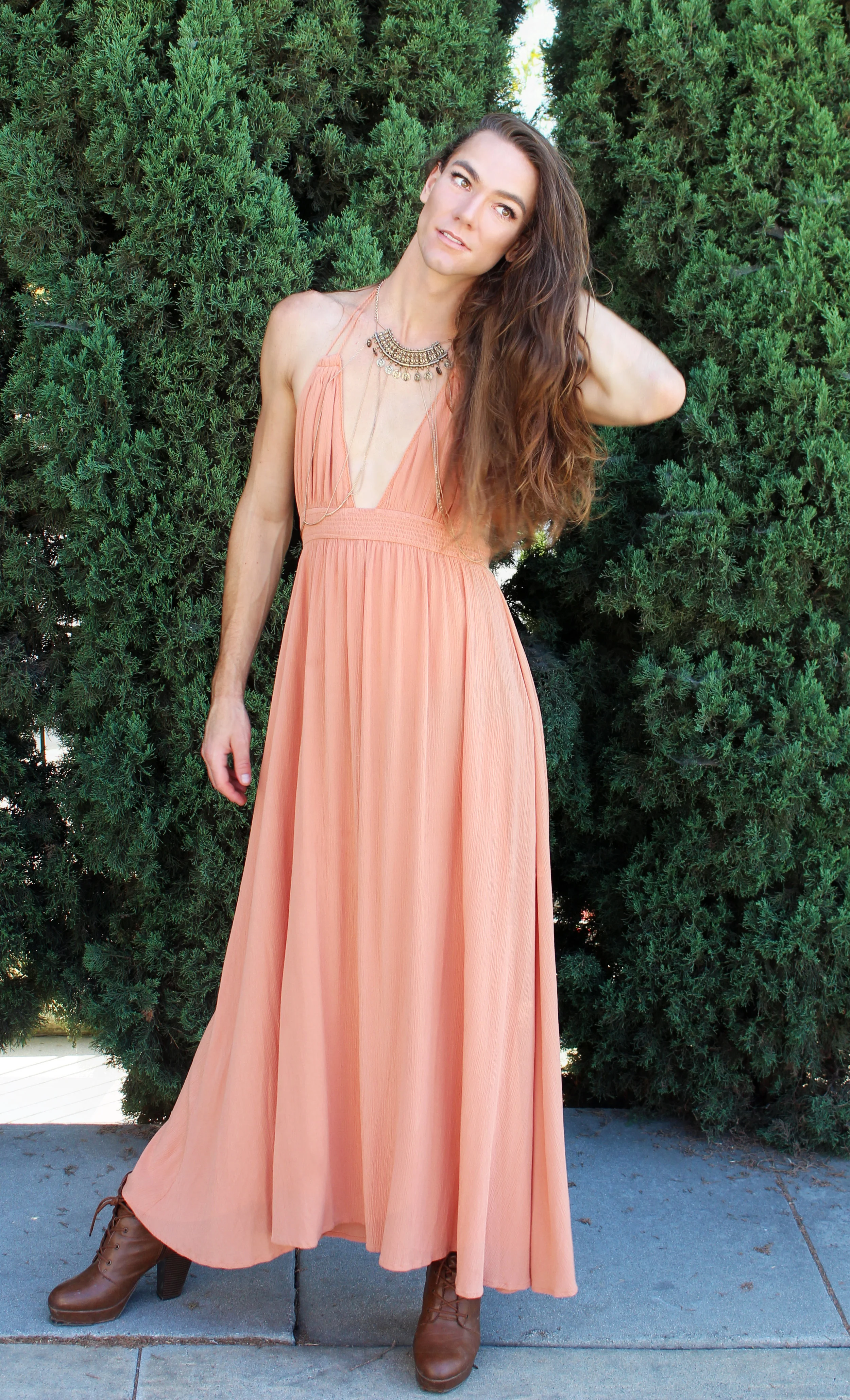 Photo by: Chloe Diaz This Look is Easy Breezy. Kyle Wears a Peach Colored Dress, Brown Booties and a Statement Necklaces to Really Make this Look Work. 