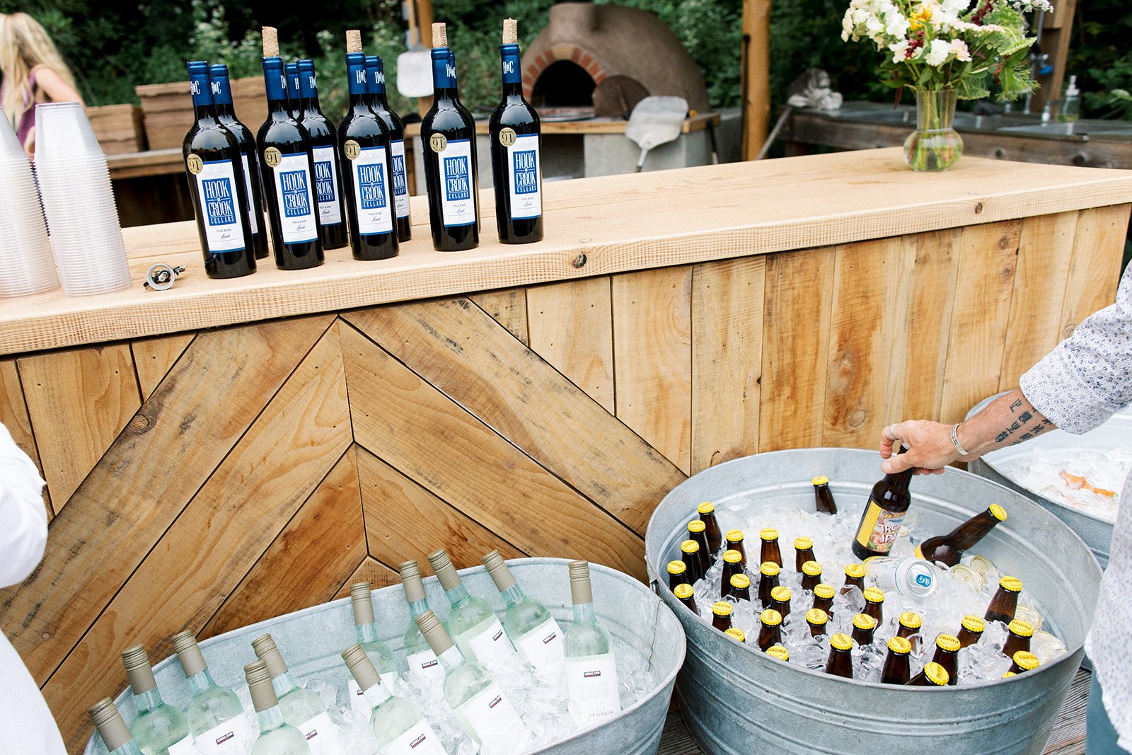 Help-yourself bar at outdoor kitchen during Rehearsal Dinner