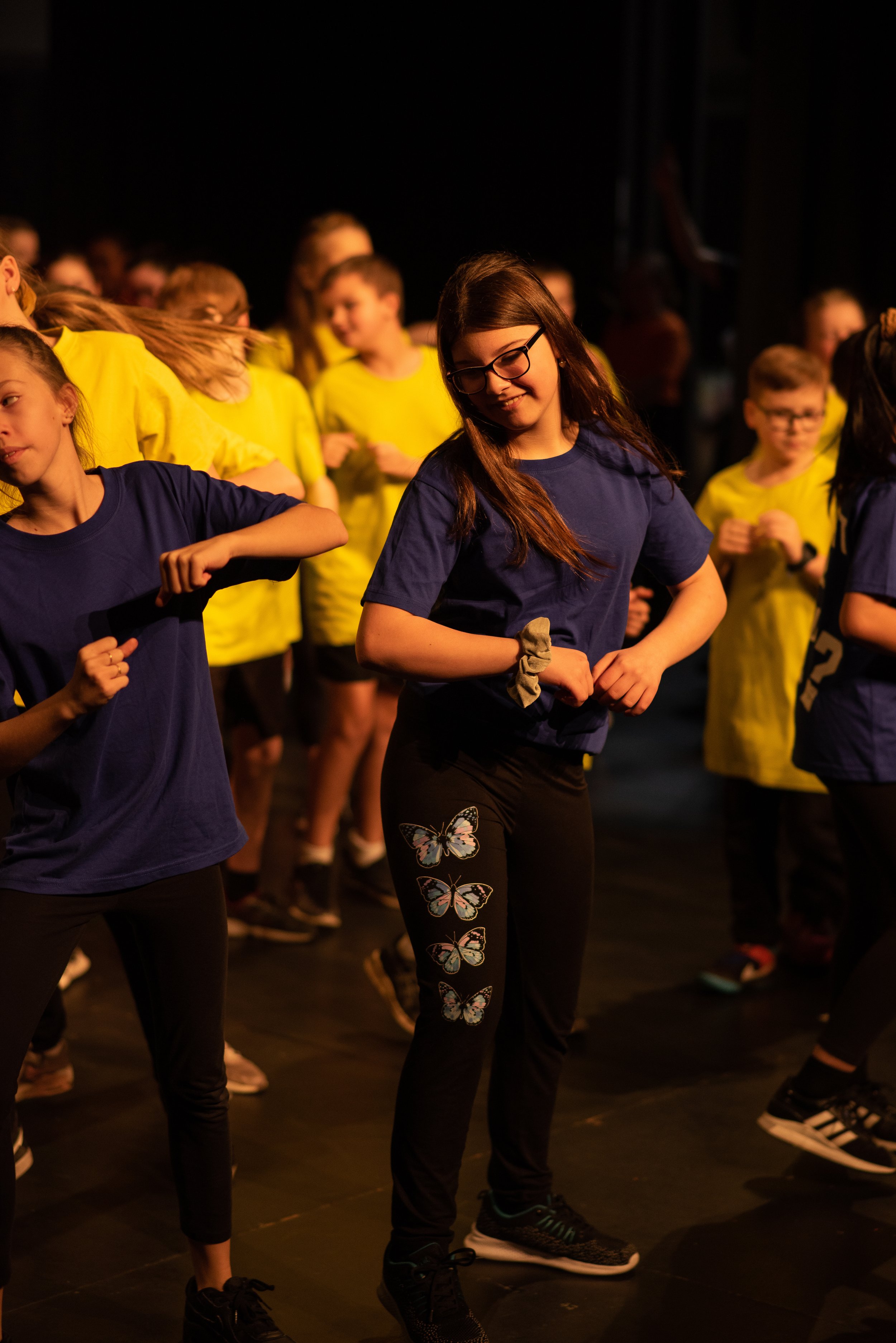 students on stage dancing