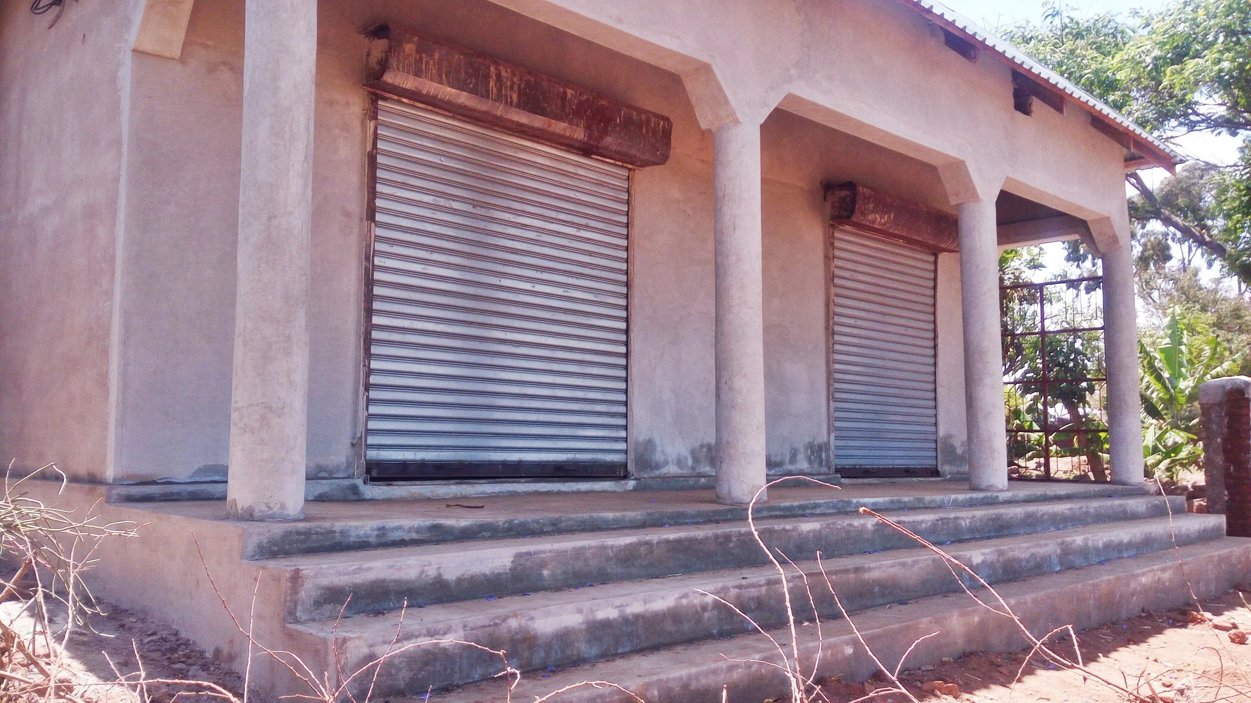School shops now plastered, steps and grates are in place!