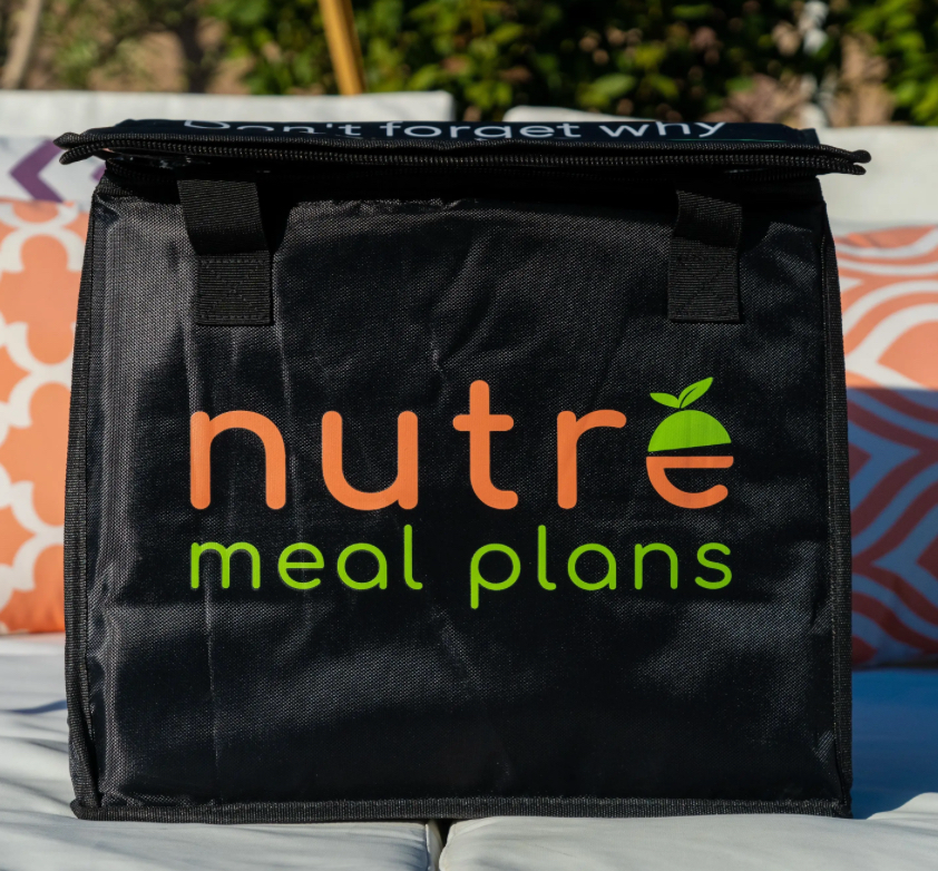 Black insulated food delivery bag with orange and green logo that says "nutr meal plans" and includes a leaf and a small plant graphic