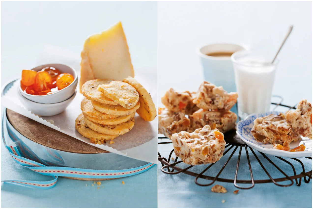 Split food items: on the left, a small bowl of fruit preserves and a stack of cookies, with a wedge of cheese; on the right, a plate of nut and fruit fudge squares, with a cup of coffee, a glass of milk, and a spoon.