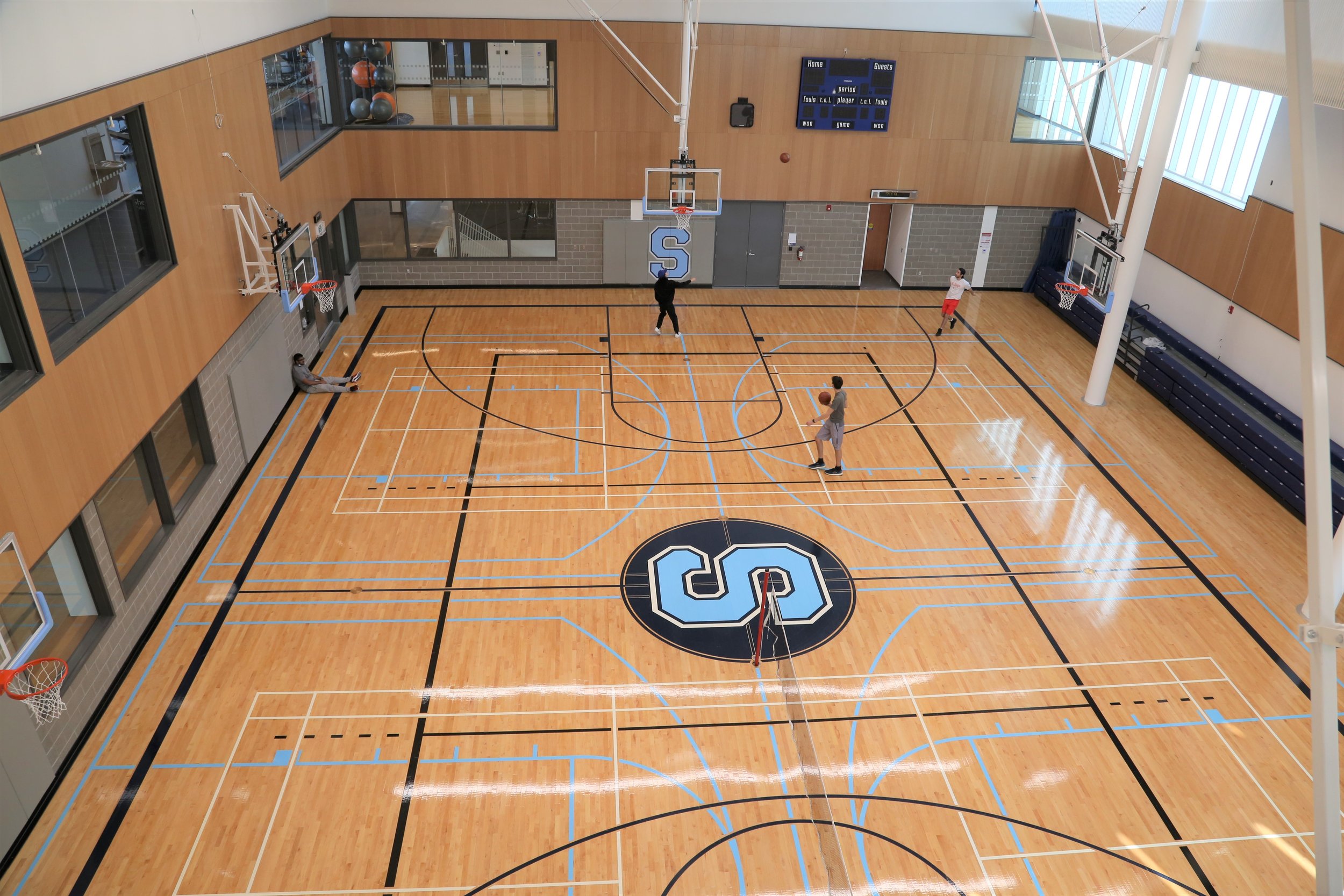  Top view of basketball court and gym at the HMC Student Centre. Sheridan Bruins logo in the centre of the court. 