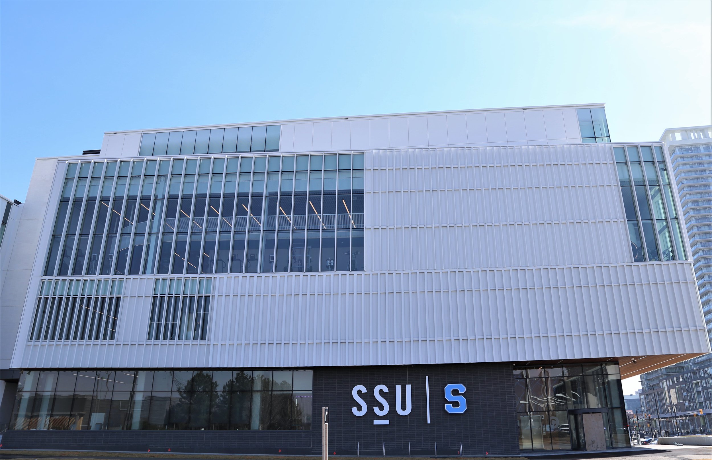  HMC Student Centre building with SSU logo and Sheridan Athletics Bruins logo engraved on the front.  