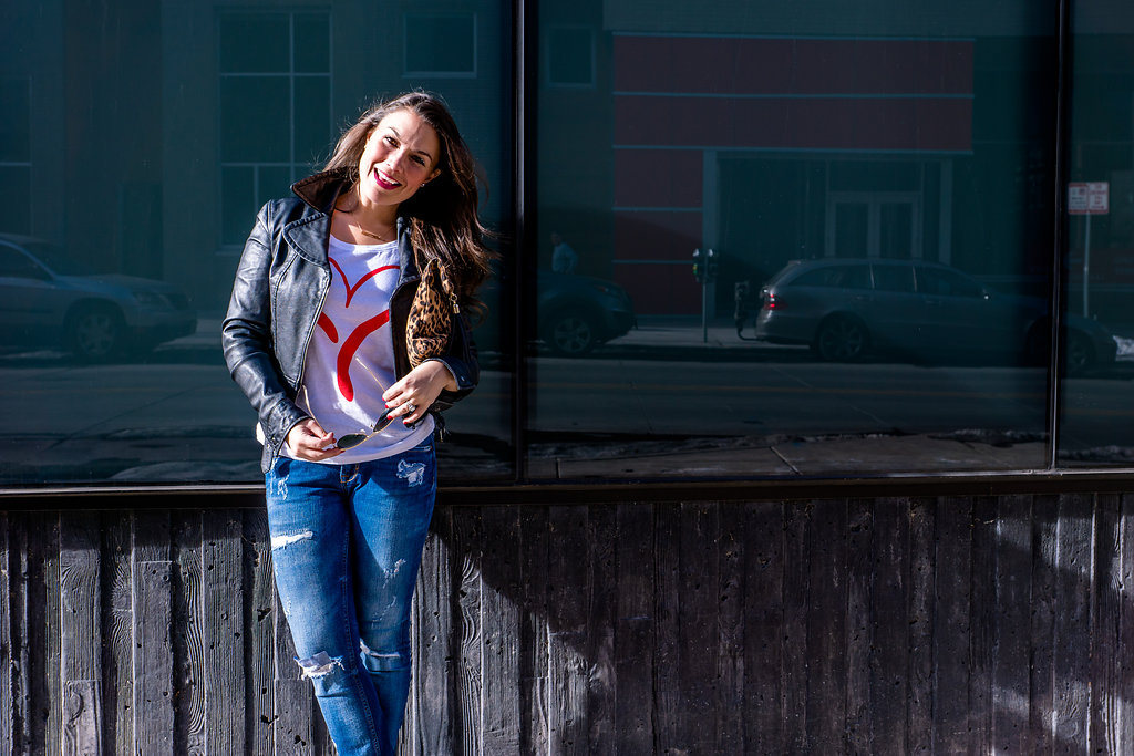  Heart graphic tee, leather jacket and distressed jeans supporting the American Heart Association and Go Red For Women 