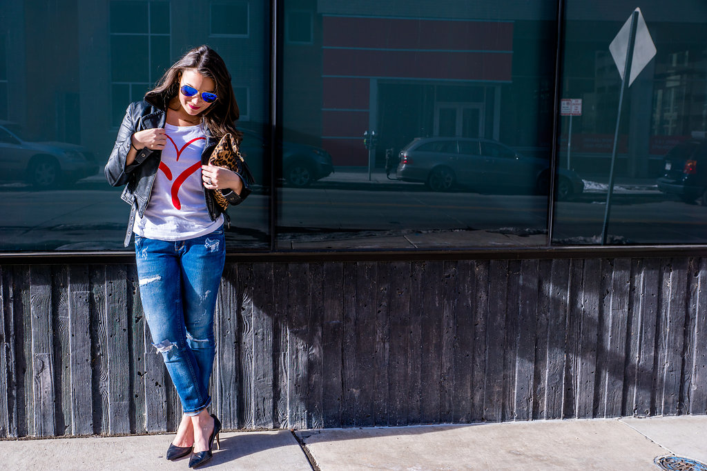  Heart graphic tee, leather jacket and distressed jeans supporting the American Heart Association and Go Red For Women 