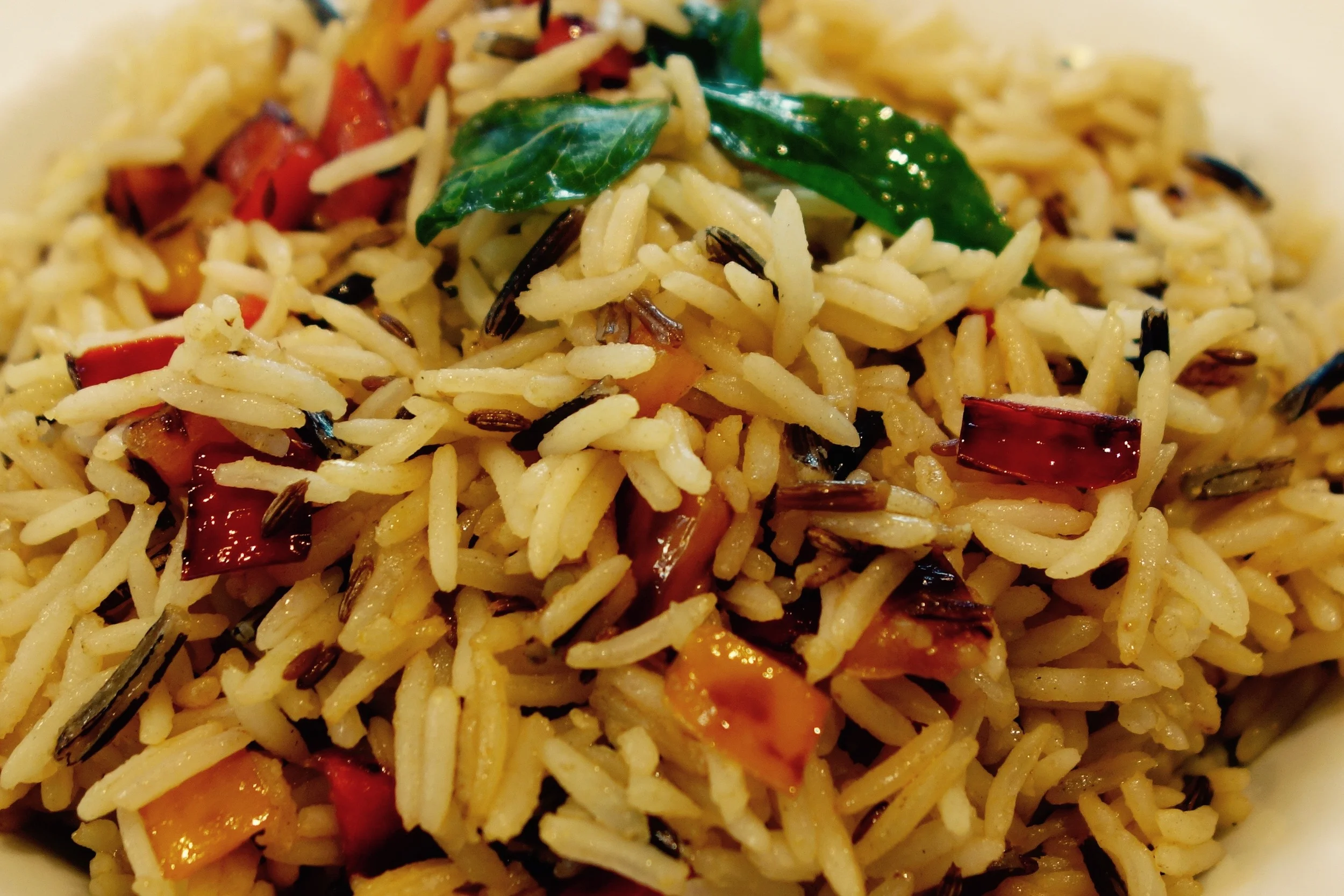 Jazzing up plain boiled rice with cumin and peppers.