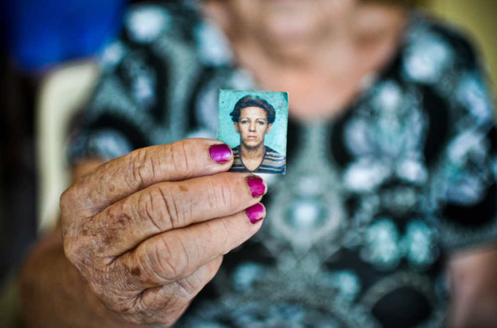 Francisca Ferreira Dr Vasconcelos showing a photo of her daughter, Dandara Dos Santos, 42, who was brutally killed in Brazil last month.(NYTIMES)