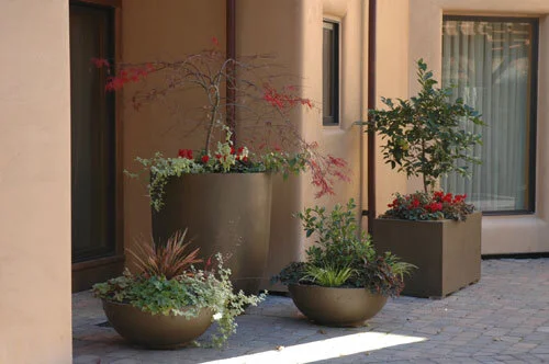  Many styles are shown here in bronze finish. Th planters are often used for hotels, conference centres and shopping malls.   