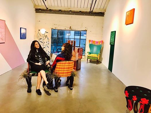 Carola Zertuche (l) and Lorena Zertuche (r) seated on Lorena's "Courting Bench" on display during her 2016 exhibit at the Minnesota Street Project