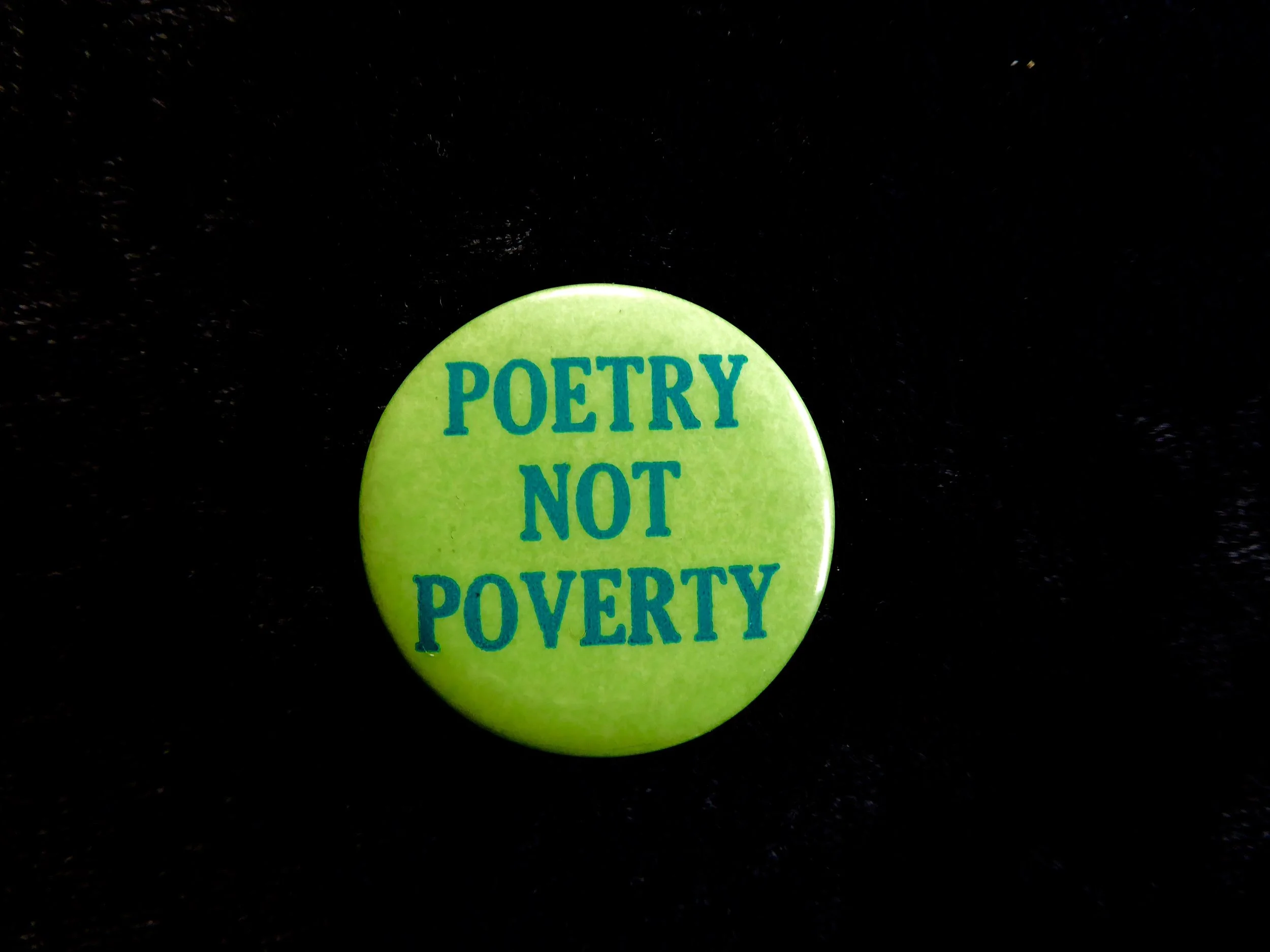 "Poetry Not Poverty" Button