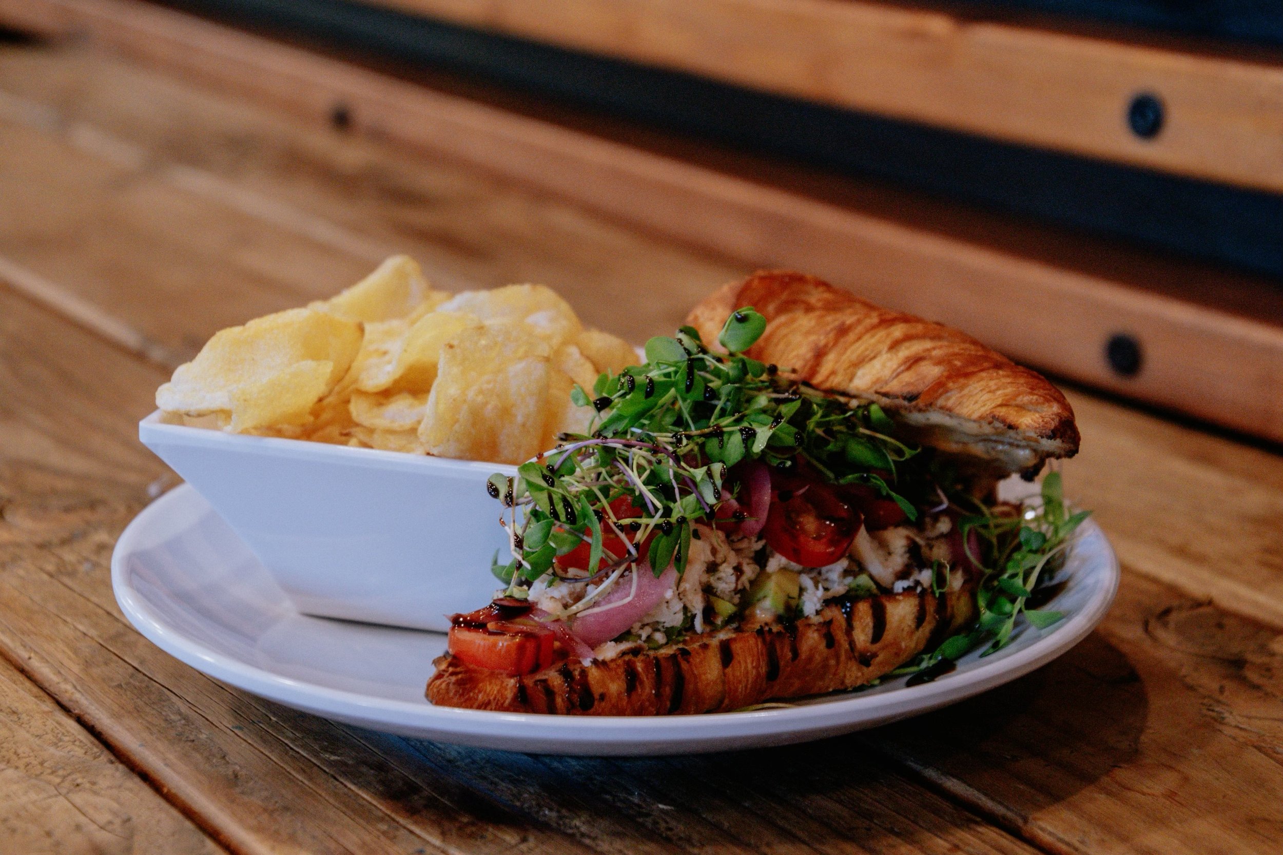  Supercalifresh sandwich, croissant with chipotle sauce, herbed chicken, avocado, tomato, micro greens and balsamic glaze. 