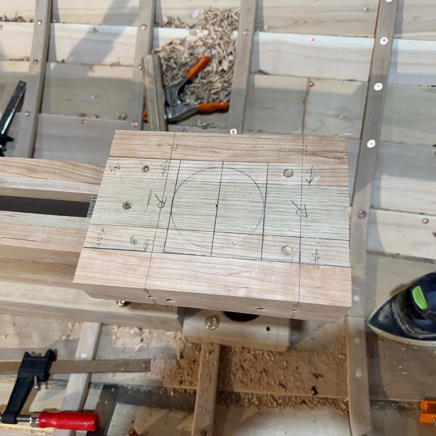 This series shows the permanent installation of the centerboard case , Mat step, and partner. The first photo shows the layout for the mast hole. Second one shows the port side permanently installed- you can see the Sikaflex oozing out. Third photo s