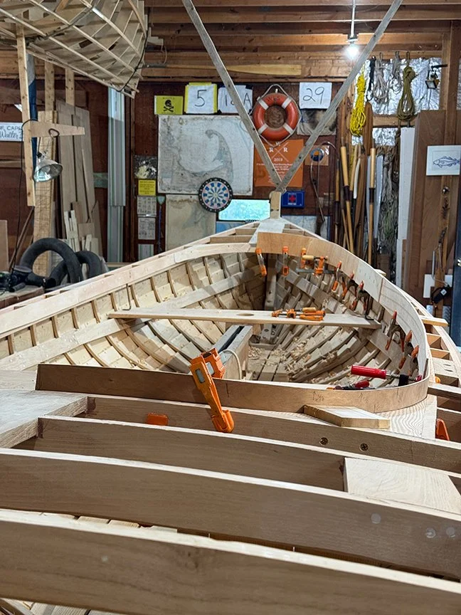 Next series of photos is laminating and fairing the oval coaming. The coaming is 1/2" cherry, with the forward and aft curved sections laminated of 4 layers of 1/8" shop cut veneers, and the middle sections full1/2". First photo shows 