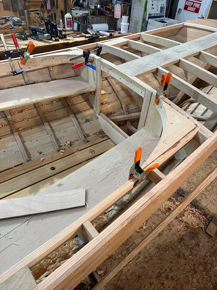 This next series shows the corner blocking for the oval cockpit coaming. Photo #1 shows the glued up fir stern blocking in place, screwed and glued. #2 shows the blocking at the bow. Photo 3 shows the stern blocking faired into the aft deck beam, pho