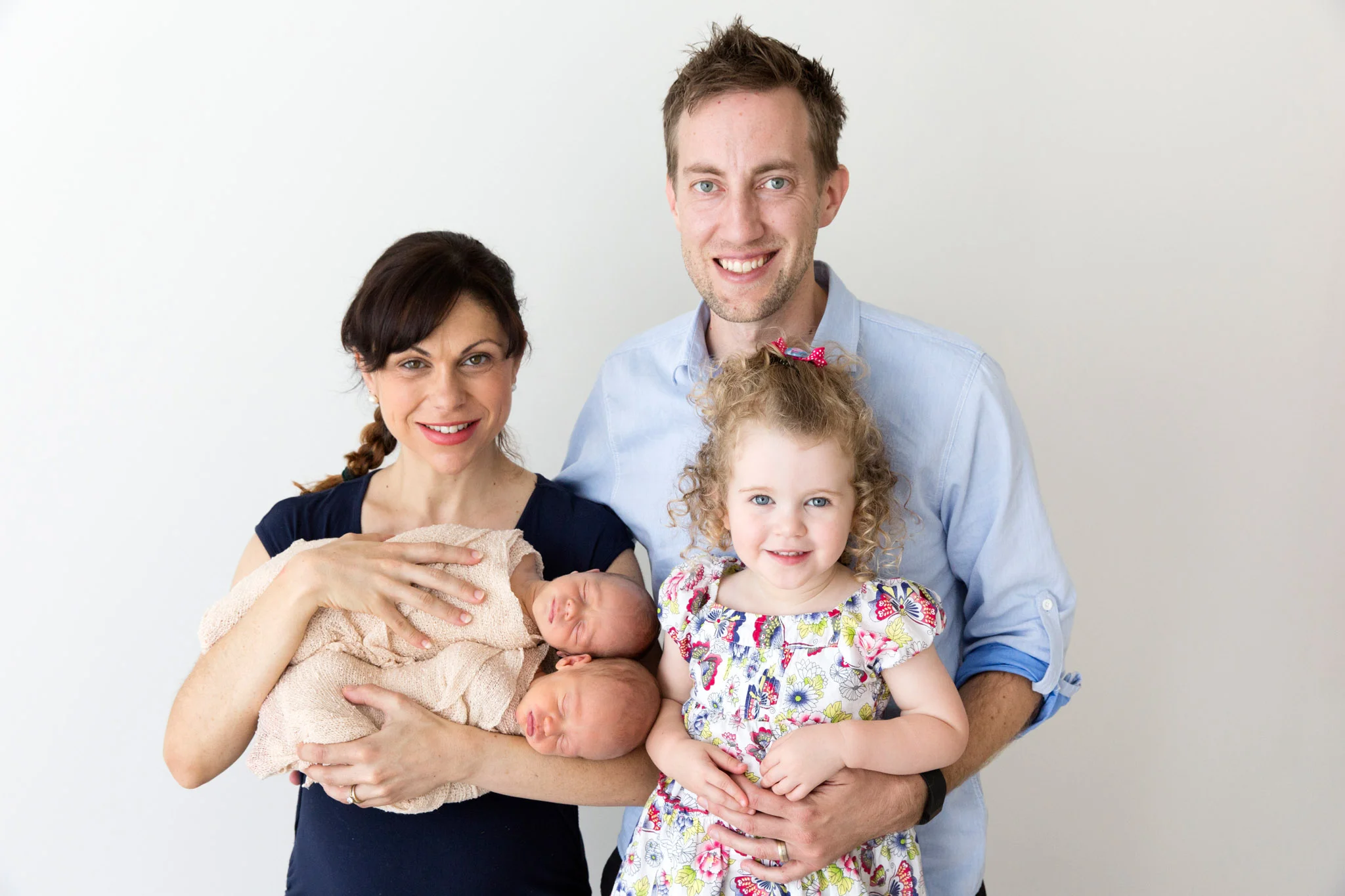 Family picture with newborn twins.