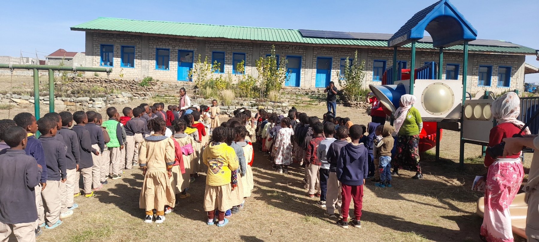 Ethiopia_students in front of school, array in backdrop.jpeg