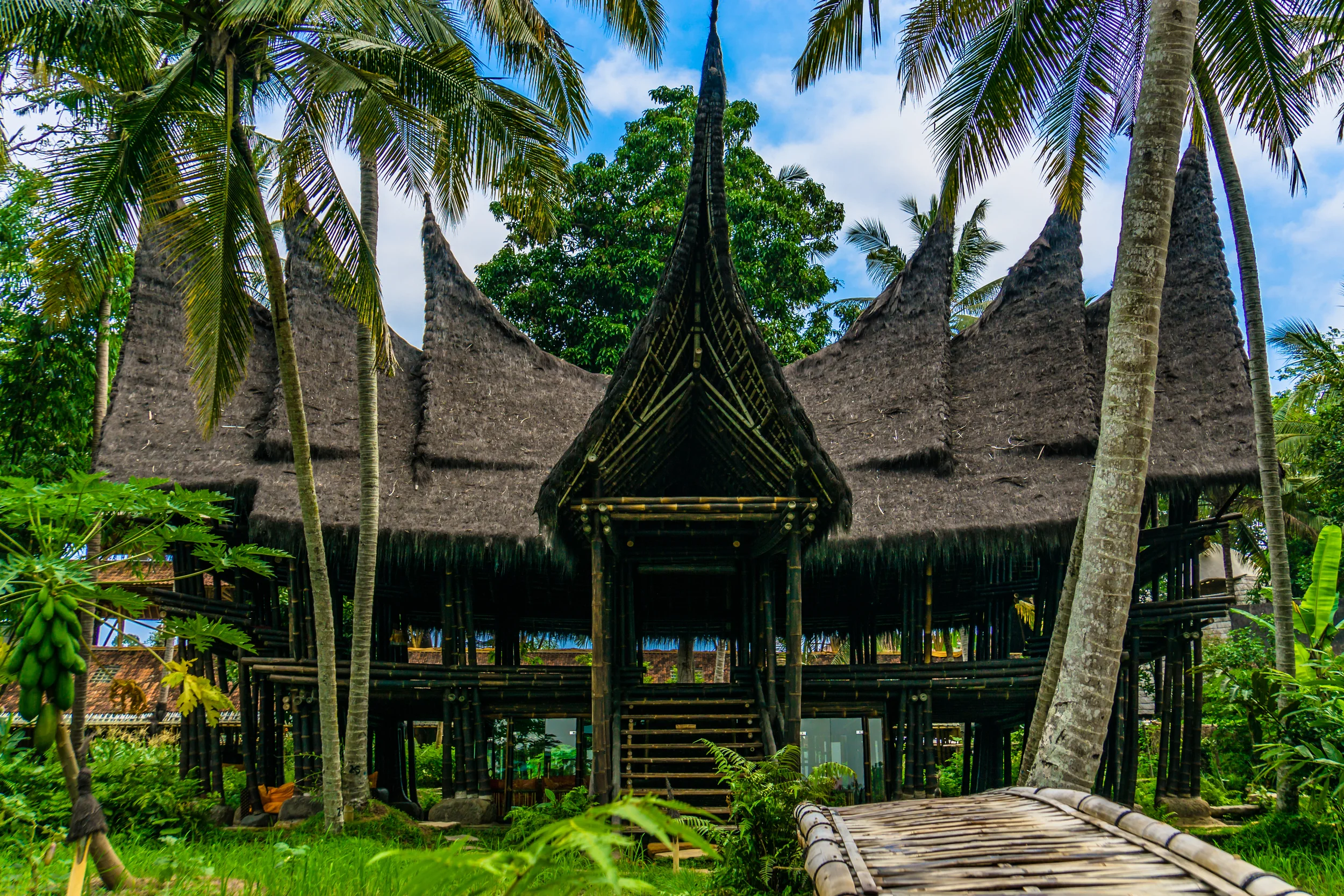 The Minang House, made out of black Bamboo, is great for large group gatherings, special events, daily Yoga classes, or evening dinner. 