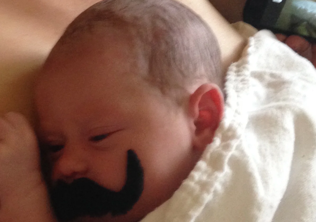 It was Cinco de Mayo in the birthing wing...and of course all the nurses were wearing fake mustaches and party beads (luckily it stopped there and didn't veer into any more problematic territory...e.g. "funny hats"). How could we resist the pho…