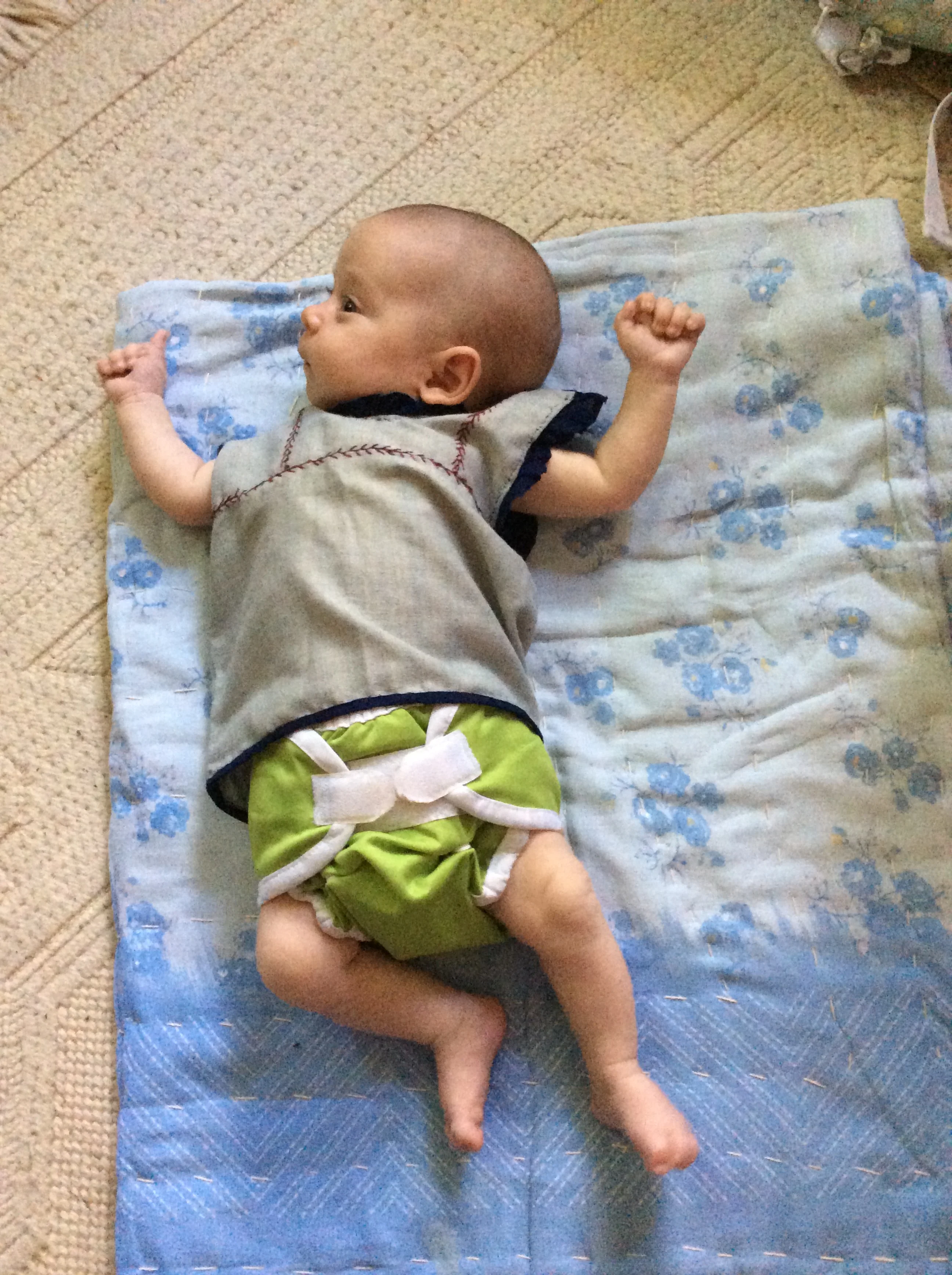 On Ben's blanket, wearing a dress made by Ben!