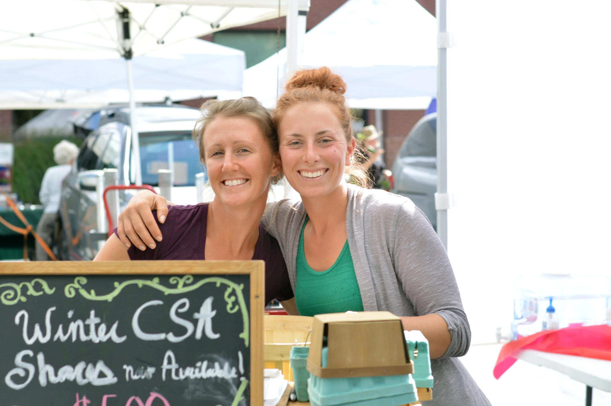 All smiles at the Larimer County Farmer's Market. (Photo by Cliff Cottage Collective)
