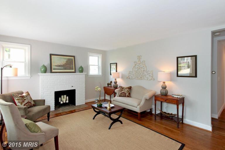 Sun-filled living room w/ wood-burning fireplace