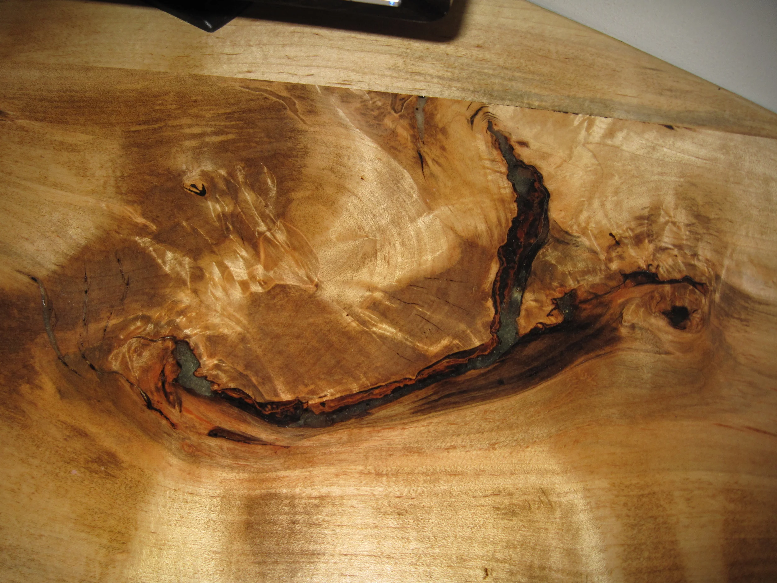 Detail of epoxy-filled "defect" in board