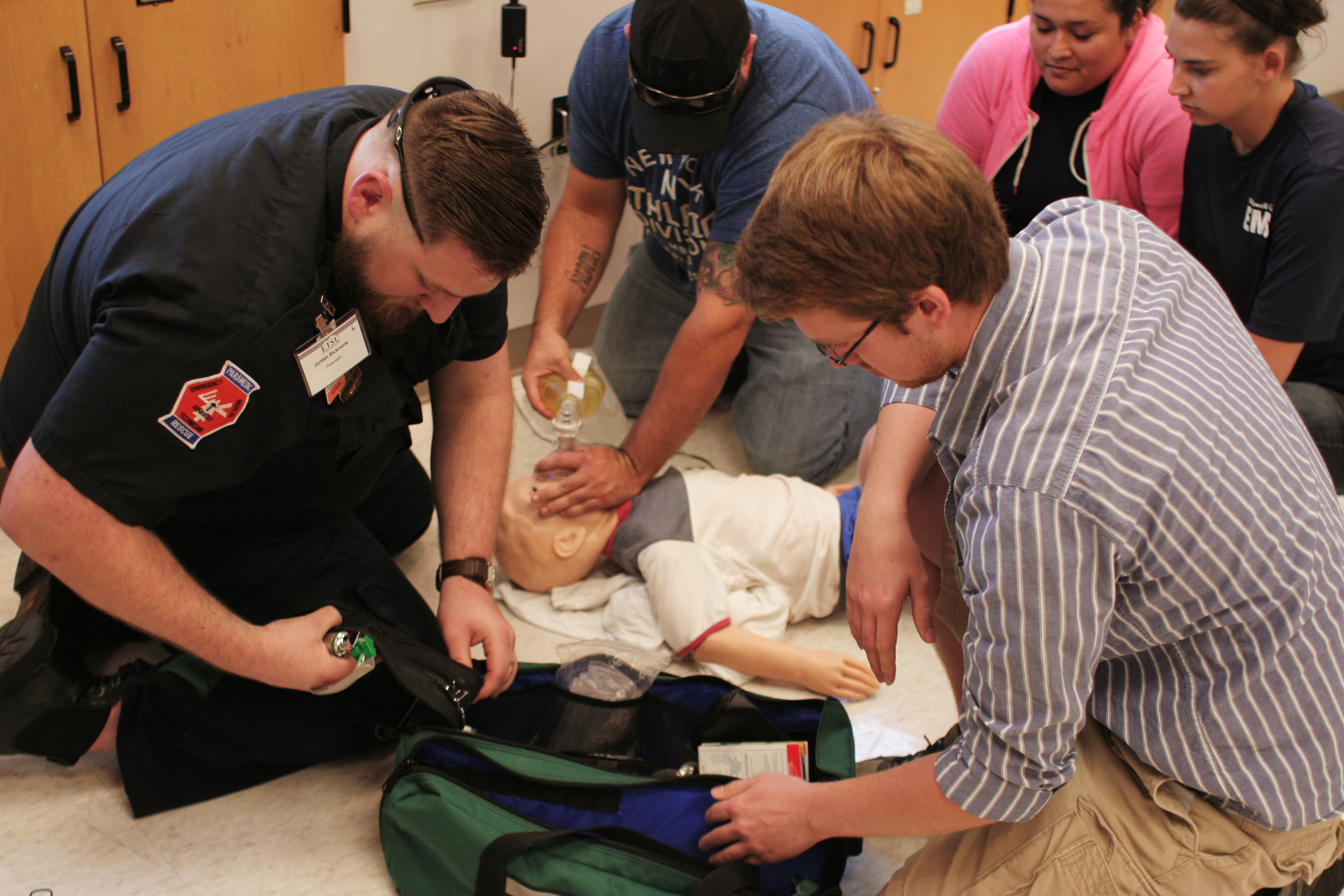   Conference attendee work together in teams in Quillen's state-of-the-art simulation lab.  