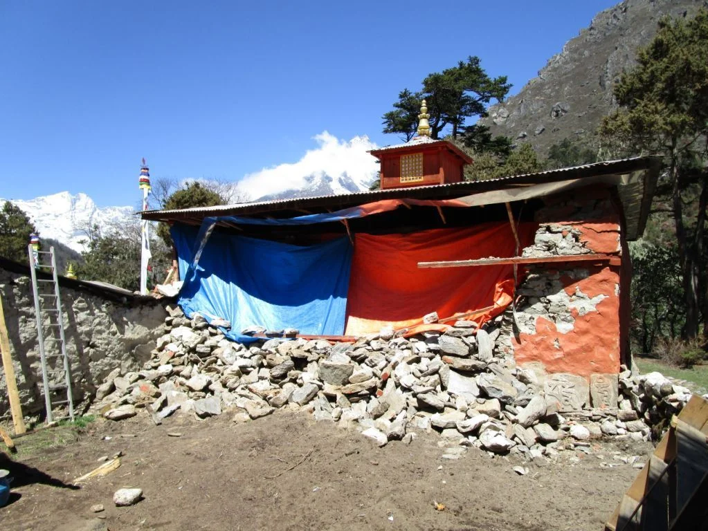 The side of the prayer hall was completely demolished. The nuns have desperately tried to protect the exposed fragile interior from the approaching rains of the summer monsoon.