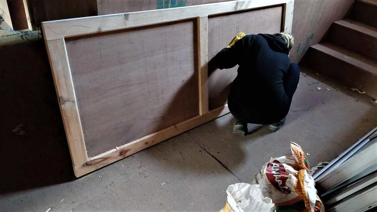 fall 2018 volunteer working on an interior door.jpeg