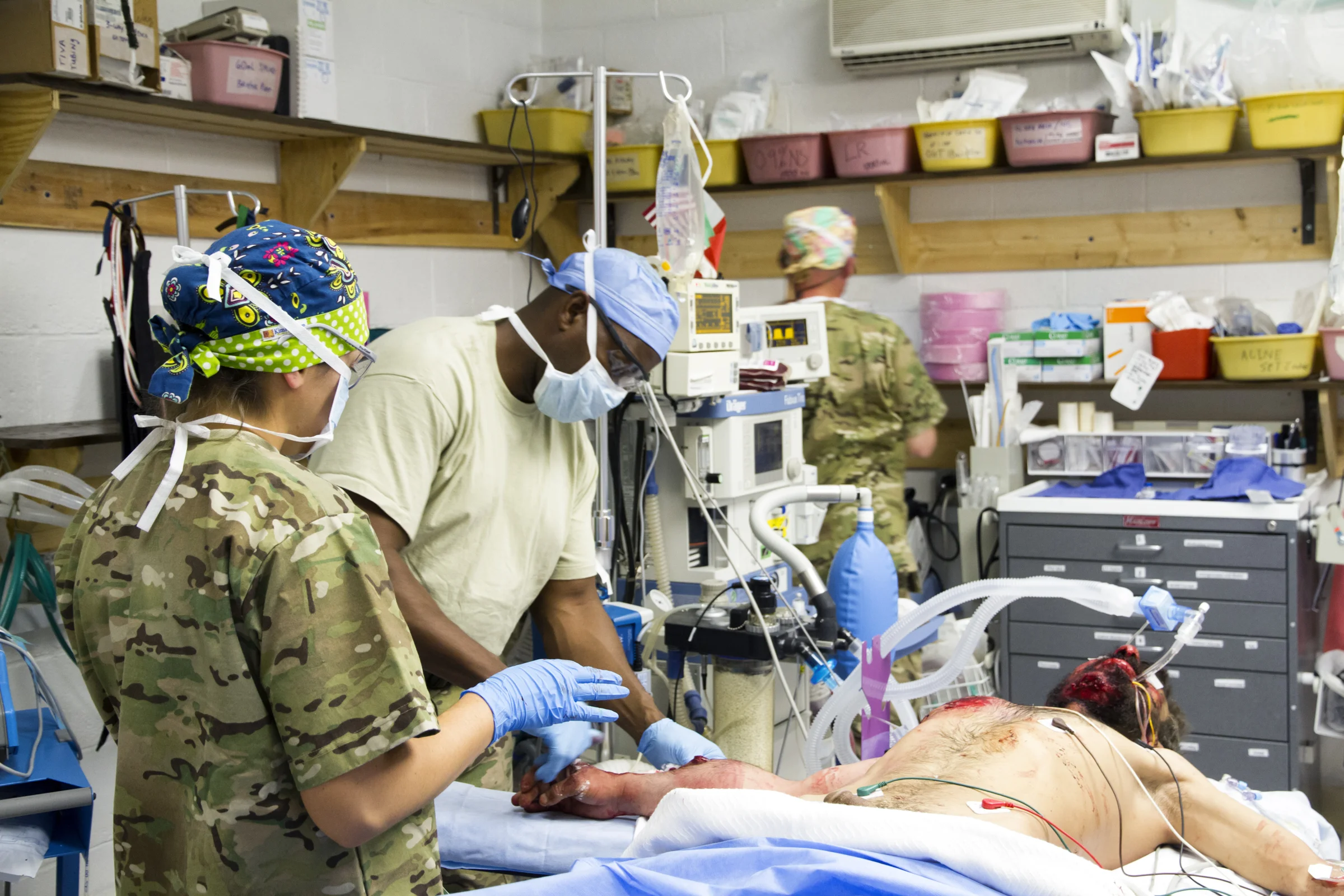 US Army medical personnel prepare a wounded Afghan soldier for surgery in the operating room at Forward Operating Base Farah (Farah, Afghanistan).