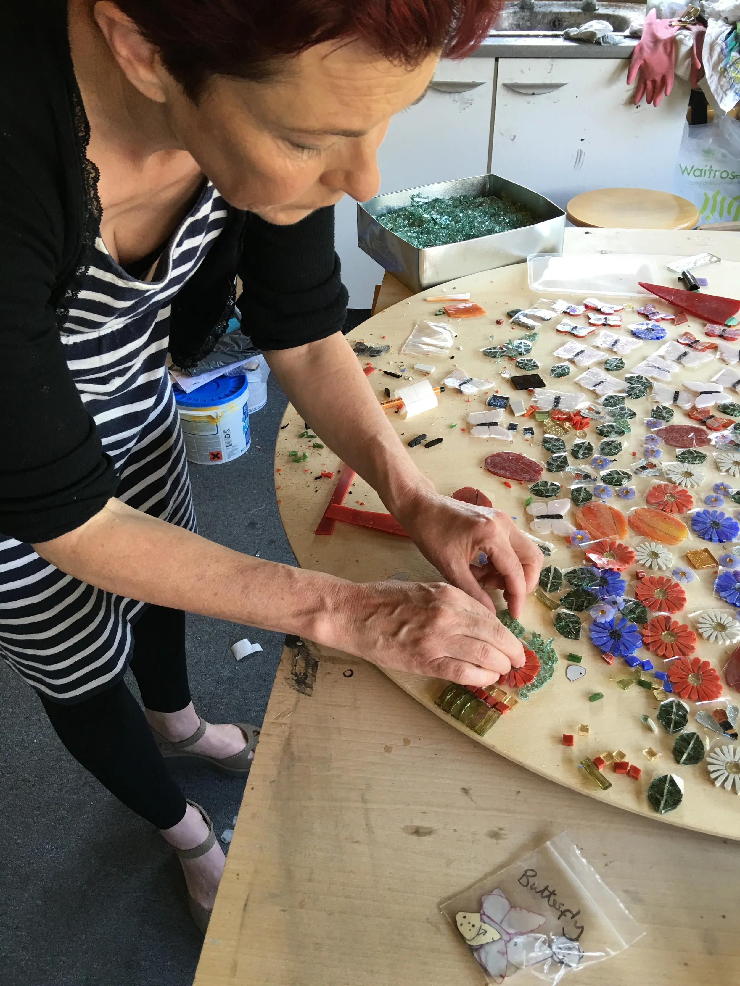 Working on the mosaic table border design.