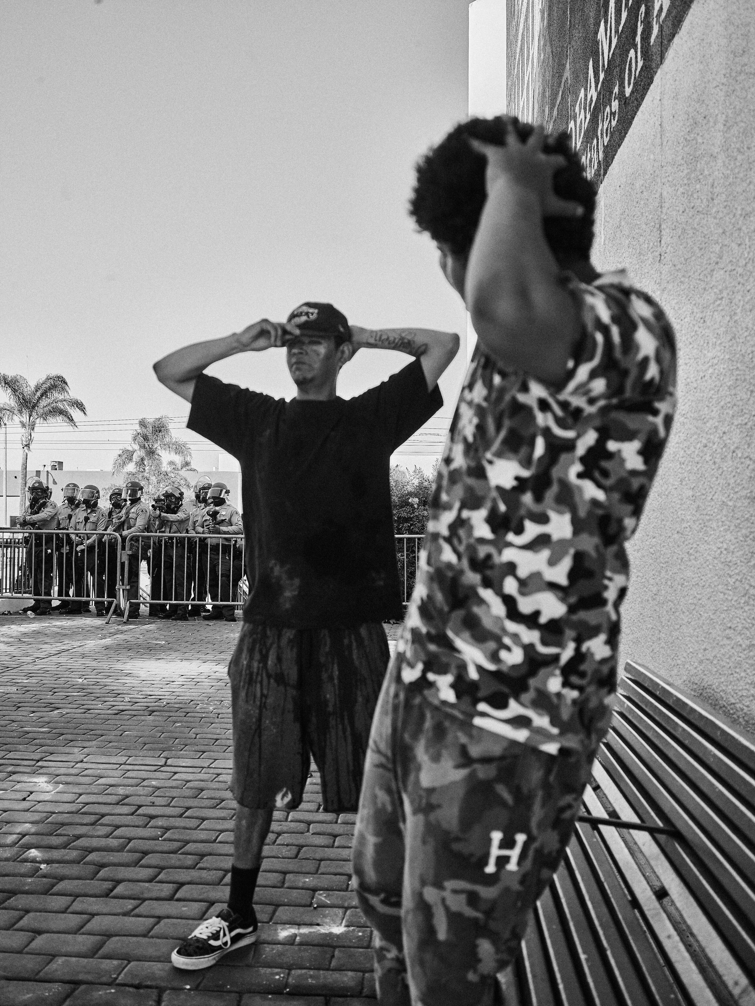 Two black men stand off against police in Compton, Los Angeles