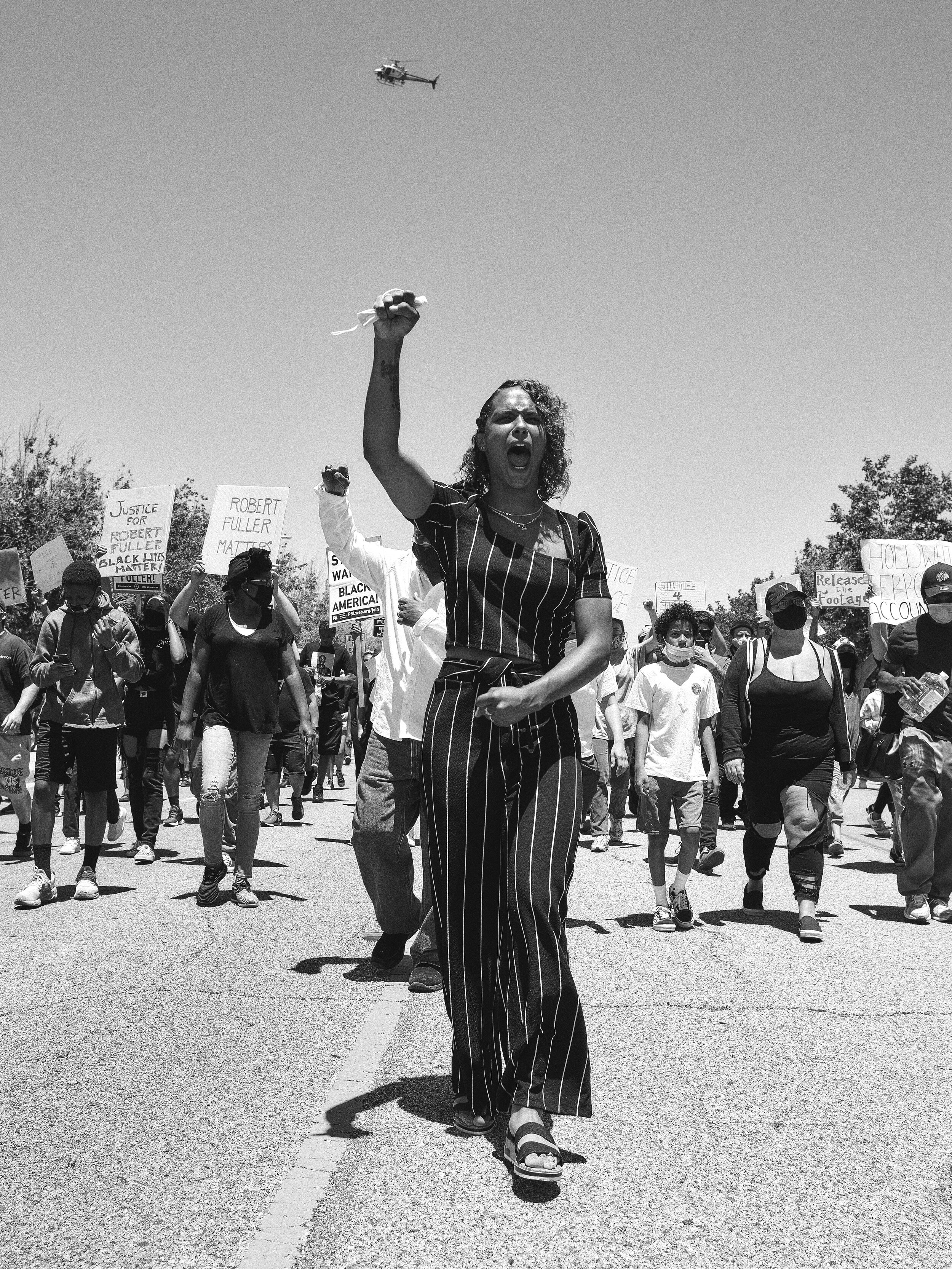 Isabel Flax leading protestors in Palmdale, California