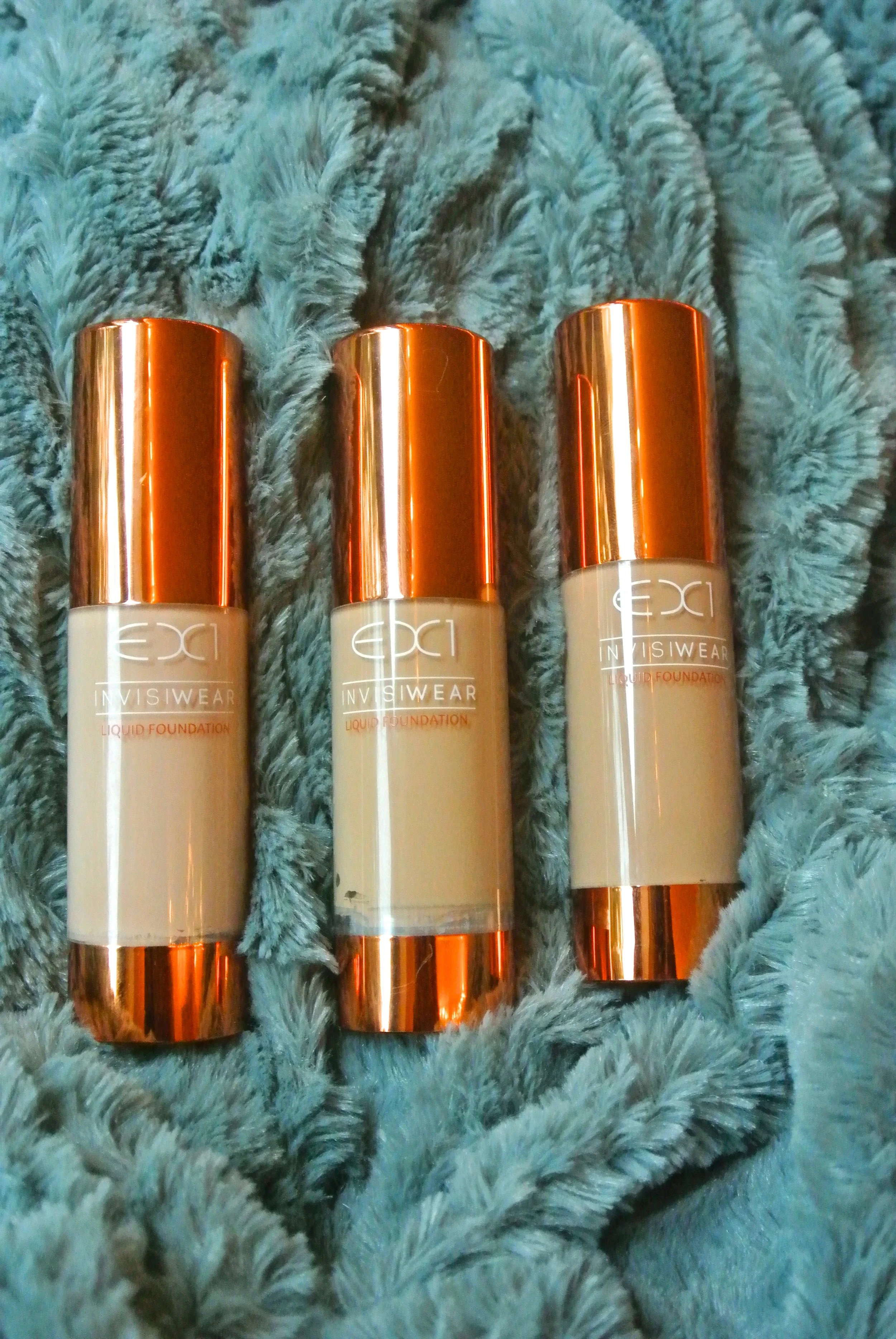 Ex1 Cosmetics Invisiwear Liquid Foundation. L to R: F100, F200, F300