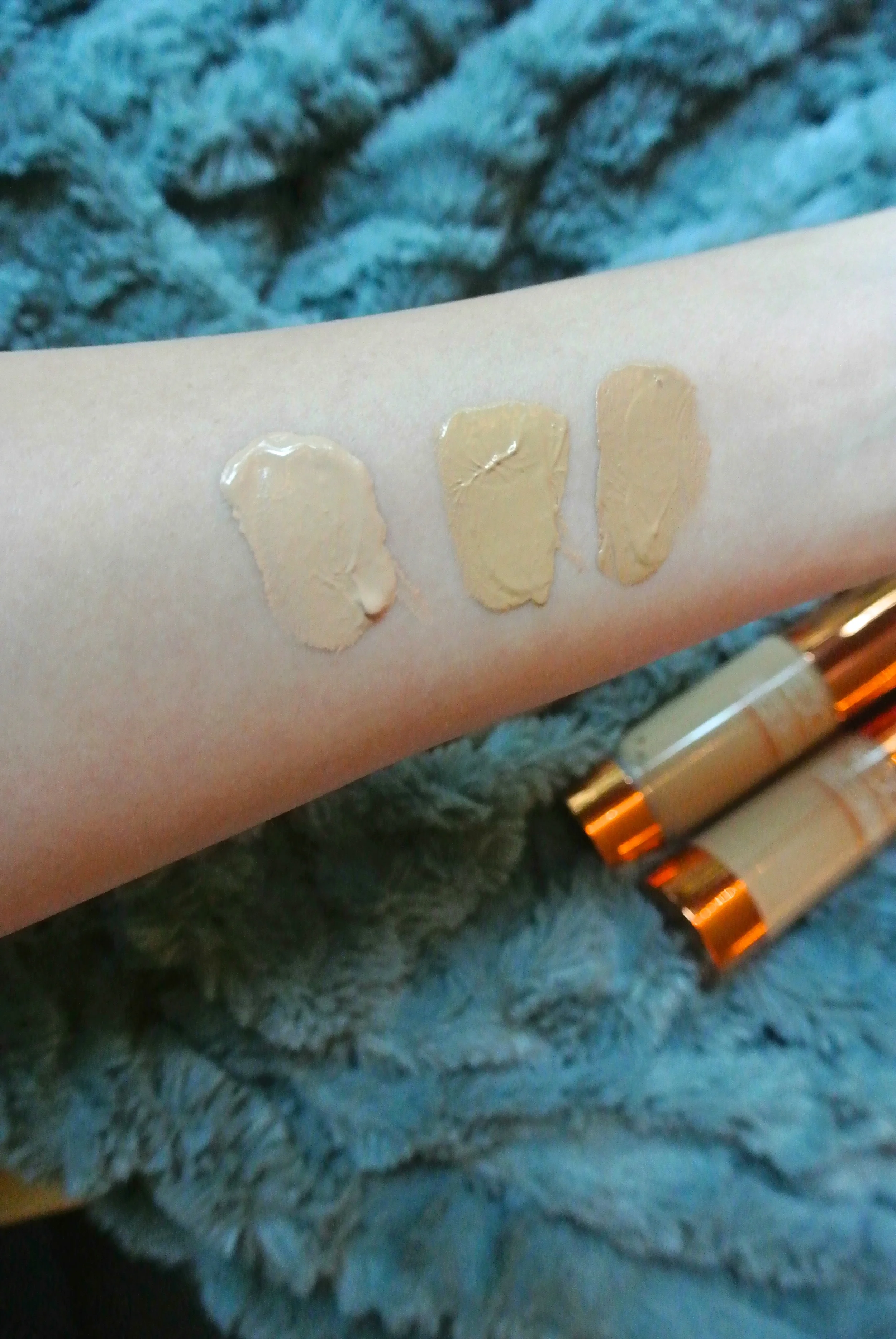 Ex1 Cosmetics Invisiwear Liquid Foundation. L to R: F100, F200, F300