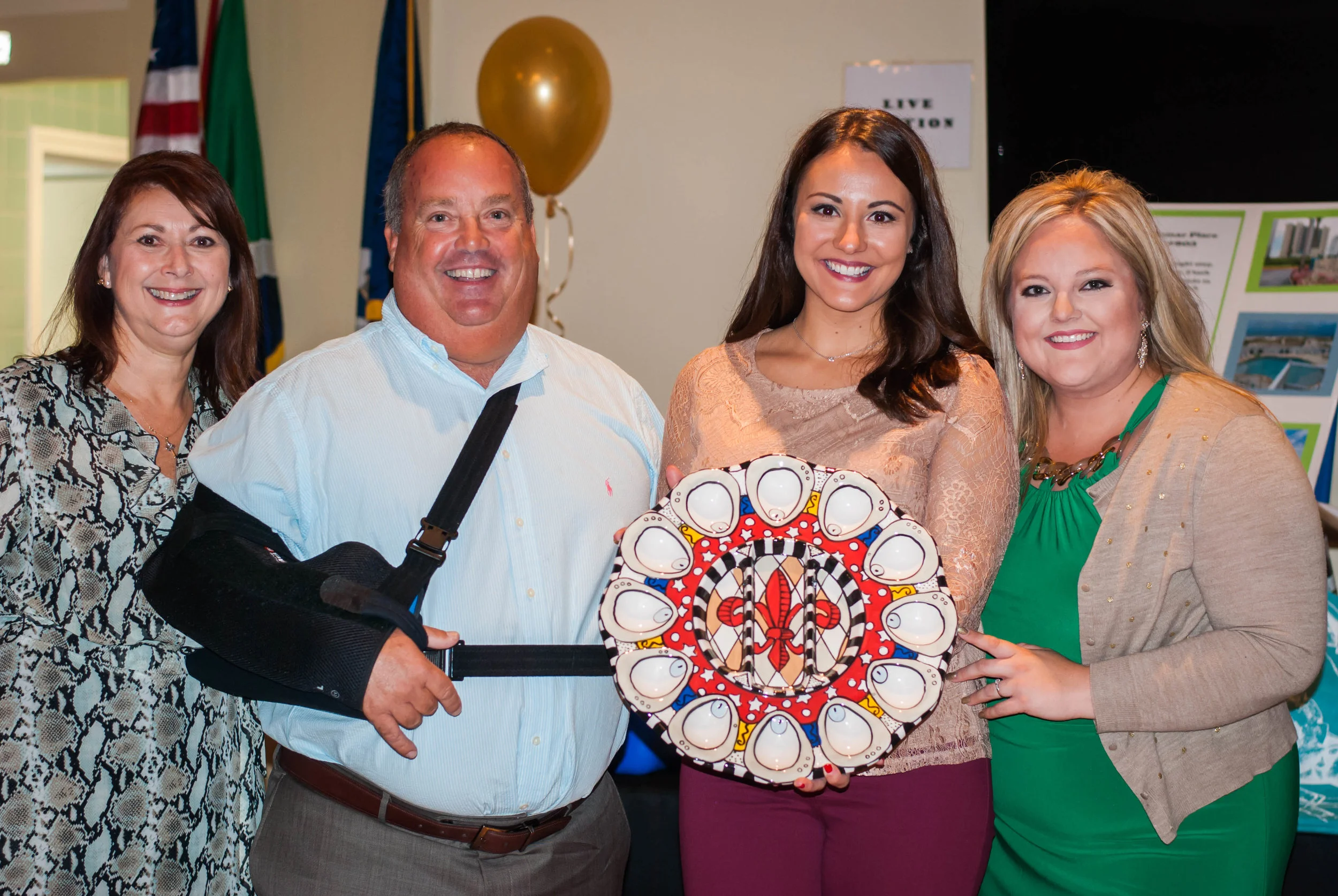 CARE Executive Director Julie Olsen, Super Star Waiters Mitch Jurisich and Eden Bubrig, Event Chair Sissy Stricklin