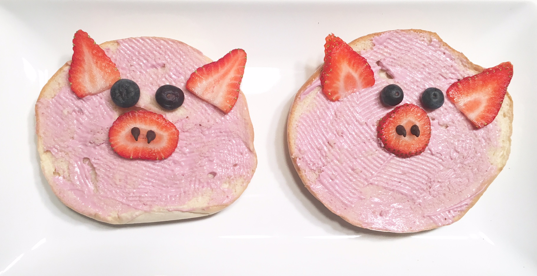 Plain bagel, strawberry cream cheese, blueberries & strawberries, and mini choc chips for the nose!