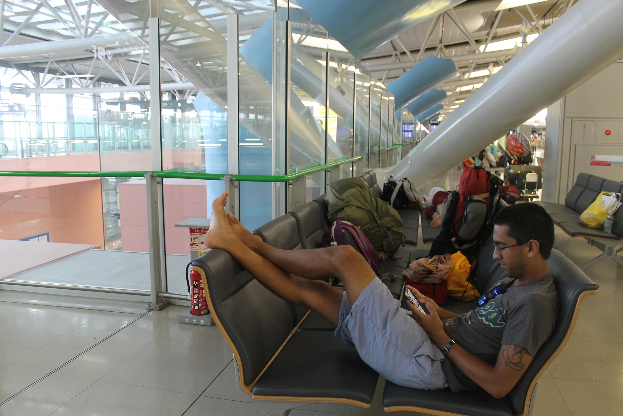 Our benches pushed together in KIX Airport