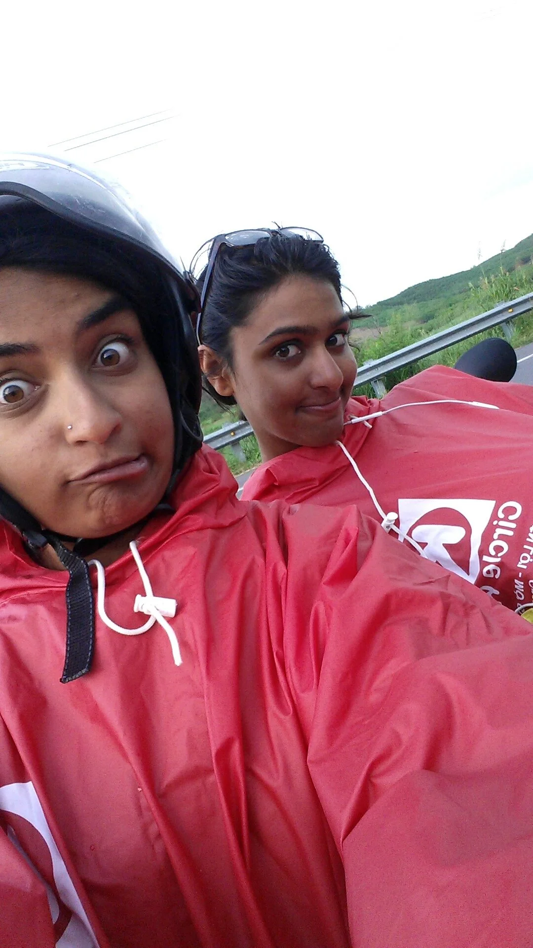 Us wearing our glorious ponchos