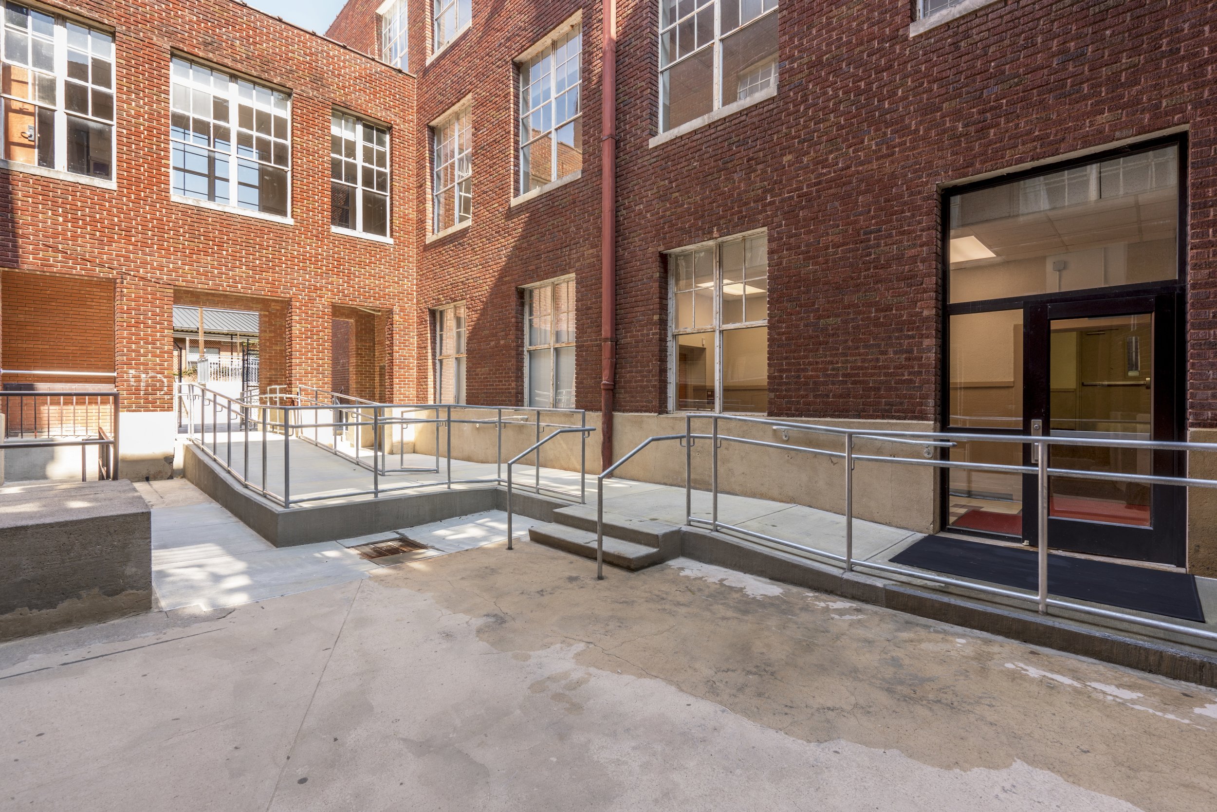  EXTERIOR HANDICAP ACCESSIBLE RAMPS added ramps in courtyard 