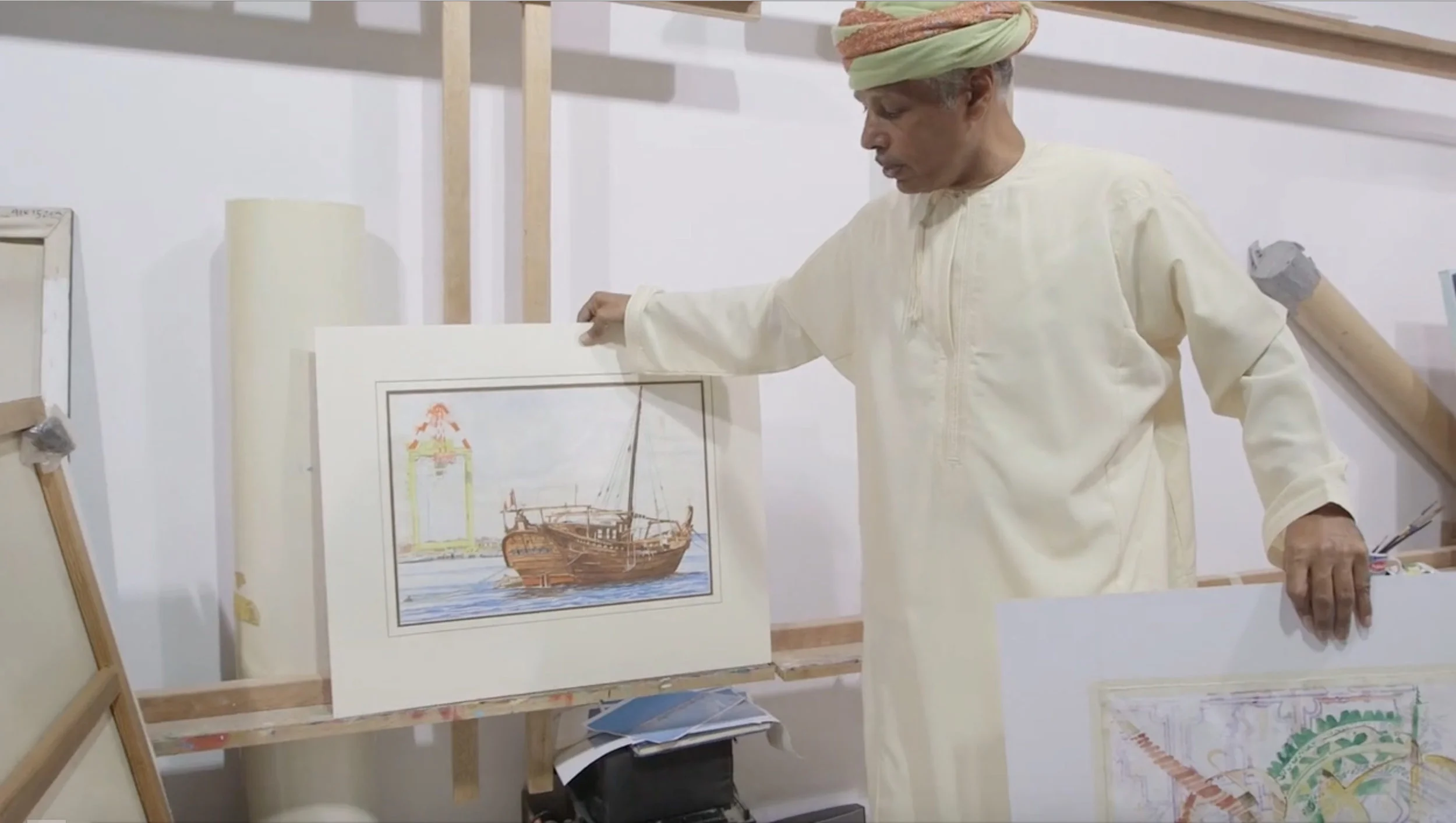 Omani visual artist Madny Al Bakry in Arts of the Monsoon . Photo still courtesy of the Smithsonian’s National Museum of African Art