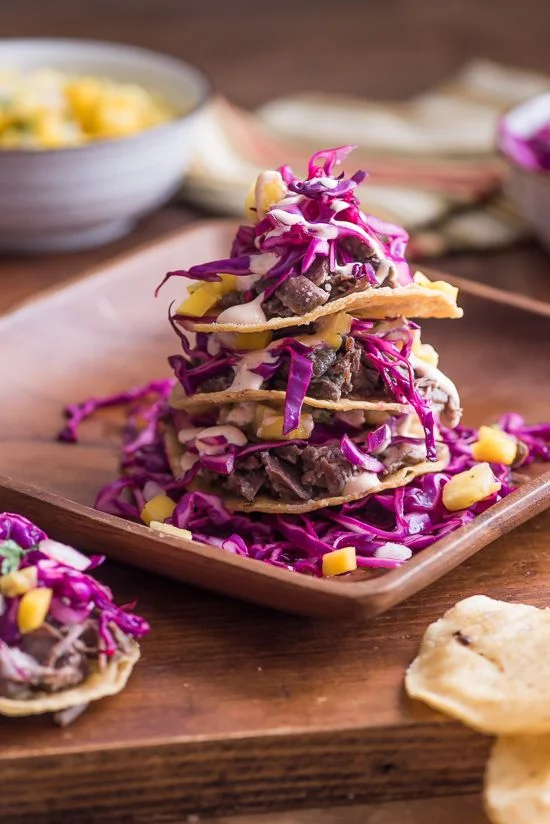 Braised Pork Cheek Tostada Stacks with Chipotle Sour Cream and Pineapple-Mango Salsa