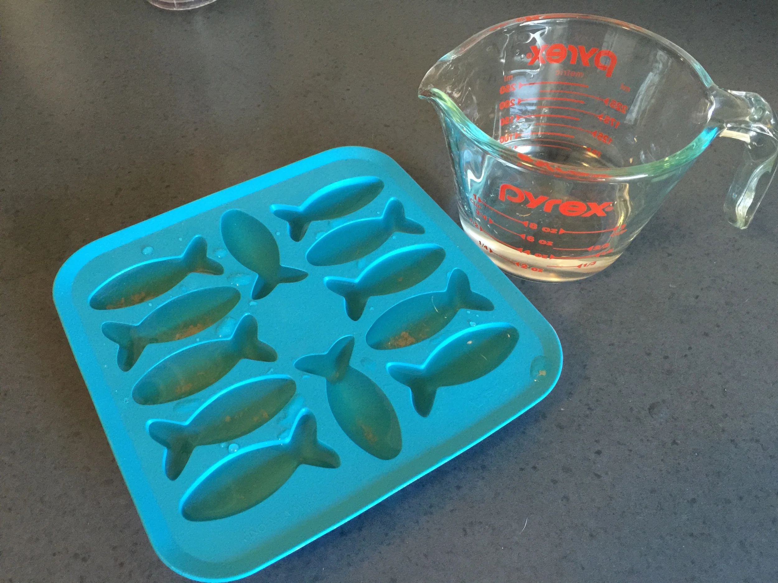 Just put littlebits of tunajuice in each fishie or whatever shape you have. Yes. What I am saying is you will not be able to fill them all up, butt that is AOK. Just put in even amounts into each shape. Yes. ................