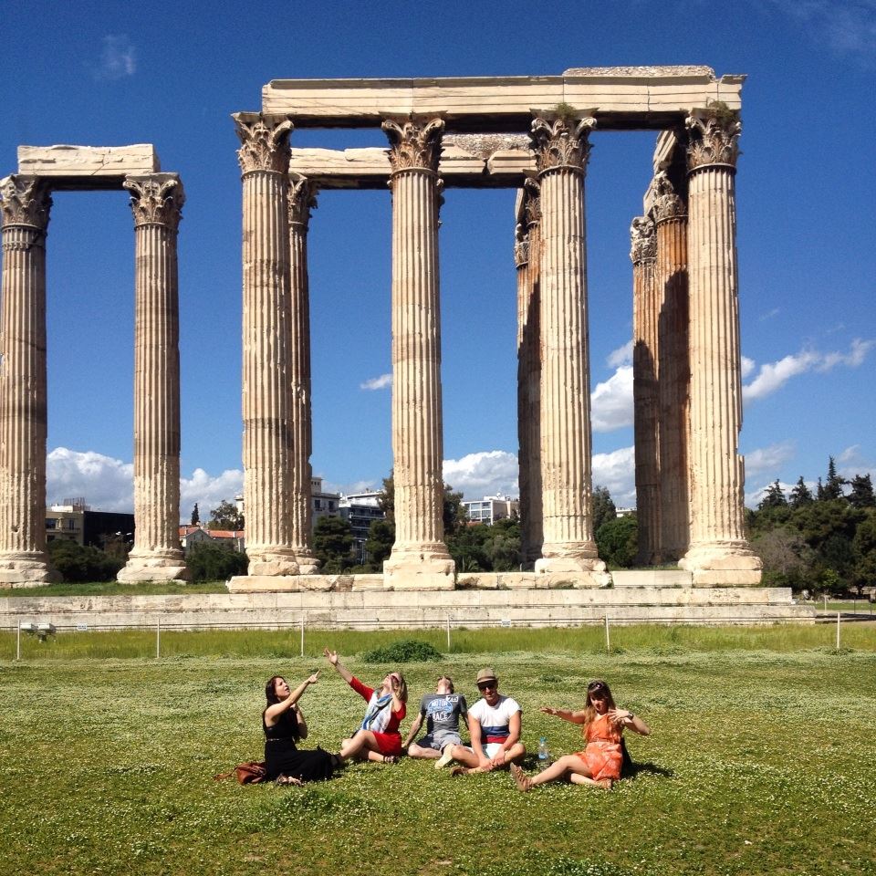 Taking a break in Greece enjoying the sun and the view at Temple of Olympian Zeus in Athens