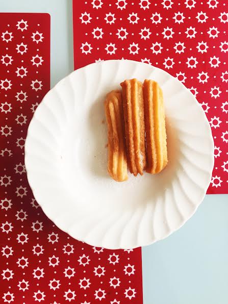 5.8 / 12:00 post meridiem // I woke up late and finally went downstairs for breakfast. When I was finished prepping my food I went to walk out of the kitchen and spotted churros left on the kitchen table. I ate one :) 