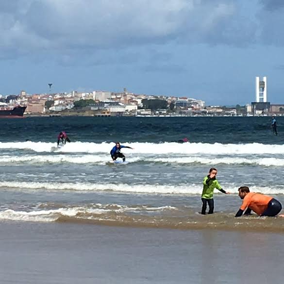 I know this image is low-quality but so what because look!! I'm actually on top of my surf board! I'm the blue and black surfer.