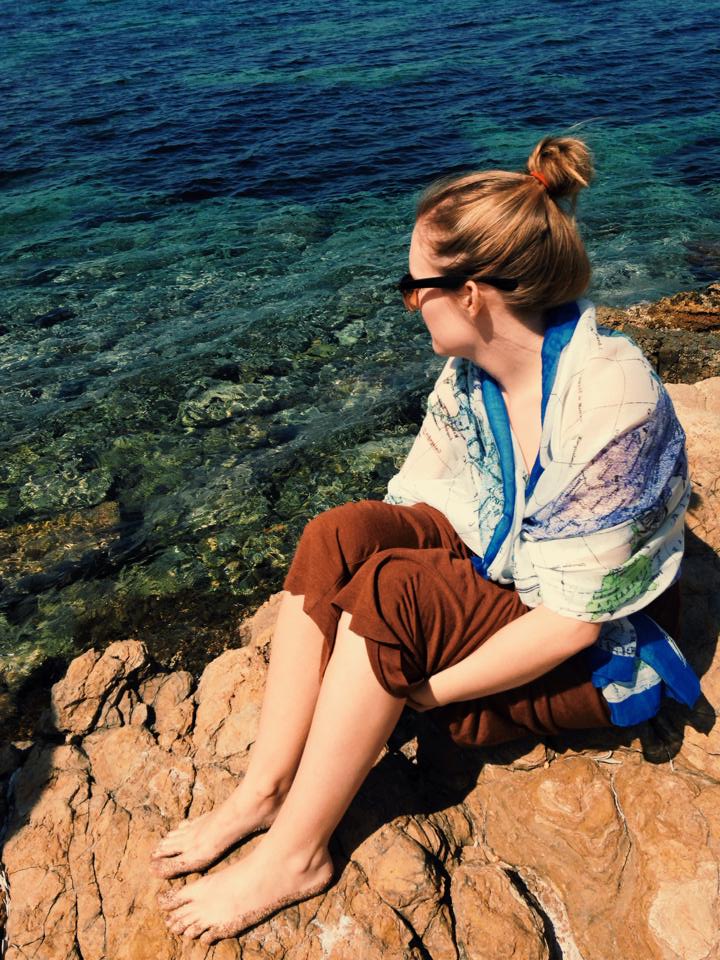 My sister enjoying the Greek sun and Aegean Sea