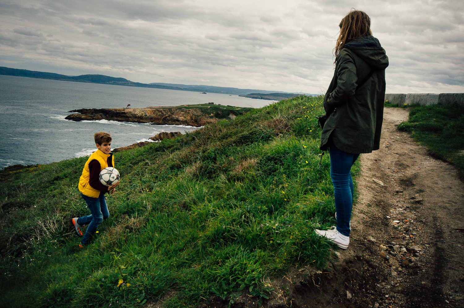 Alvaro is the oldest child. He is walking towards his mother, Maria.